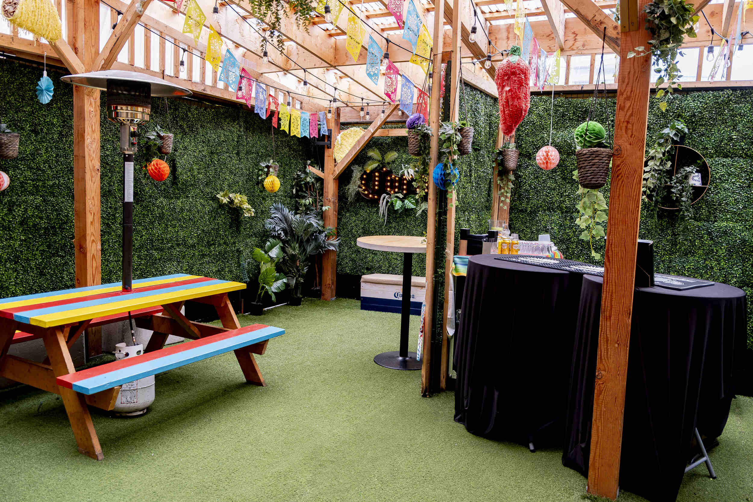 The cozy and intimate atmosphere of The Pawn Shop Hideaway patio, a heated event space.