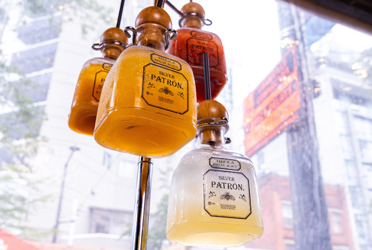 A Patron Margarita tree featuring four different Patron margaritas in mini bottles at Pawn Shop YVR in Vancouver